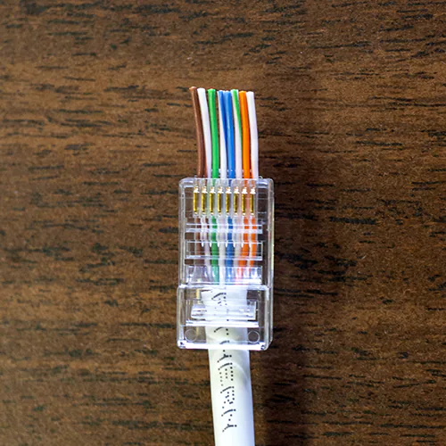 Cat5e Passthrough Cable RJ45 Connector on Table