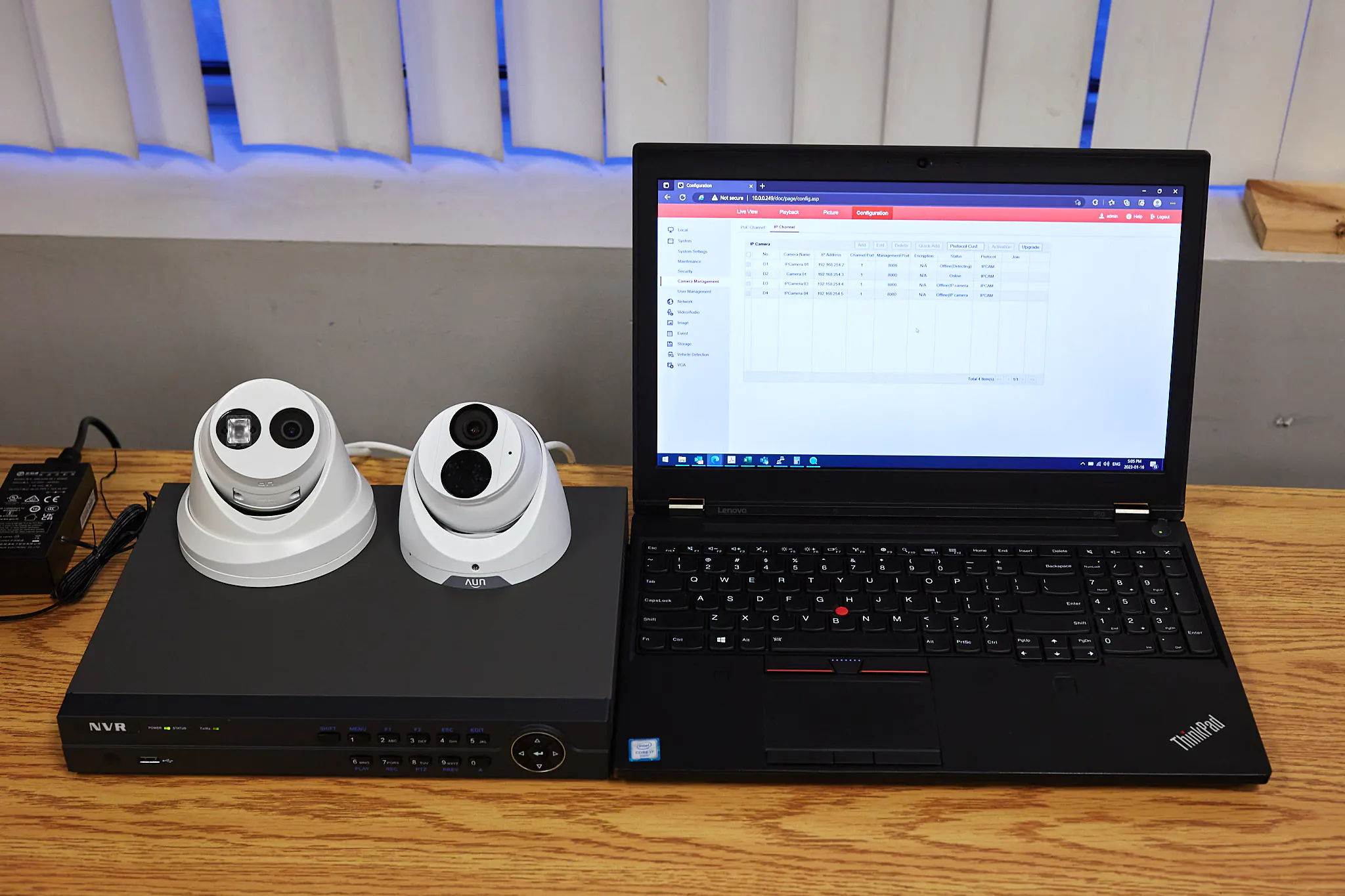 Security cameras and a Lenovo laptop on a table