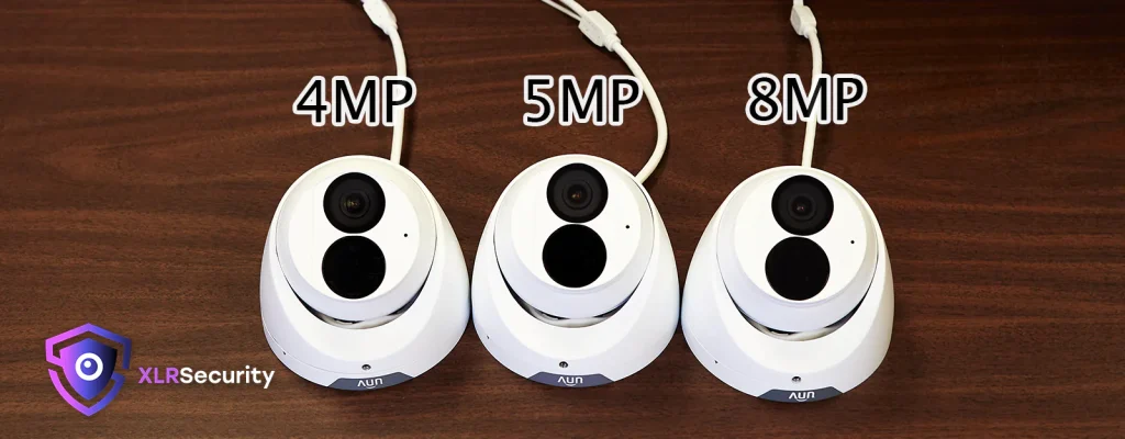 Three Uniview cameras on a table with 4MP, 5MP, and 8MP written above them in floating text