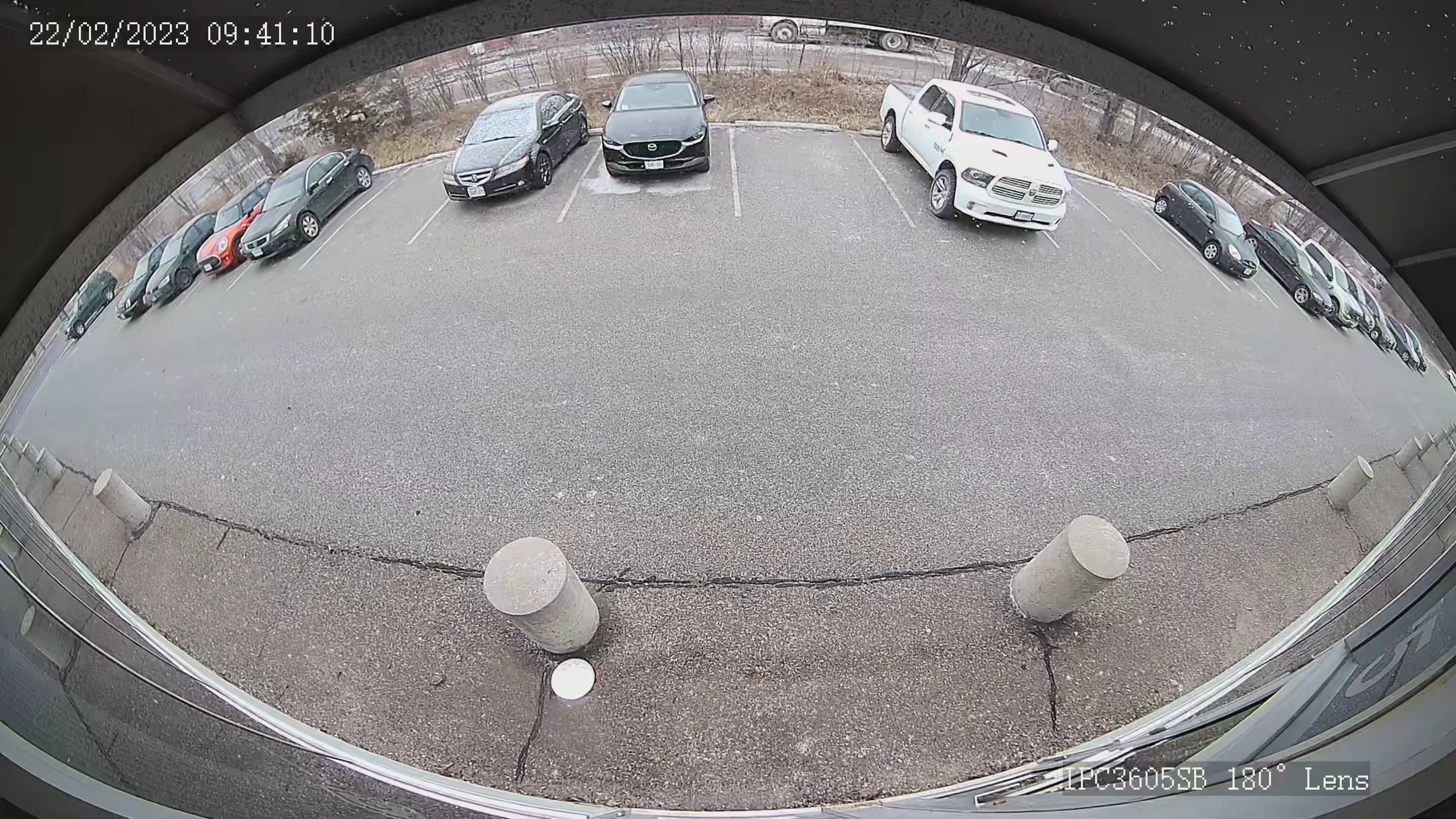 Uniview 180° wide angle camera snapshot of a parking lot during daytime