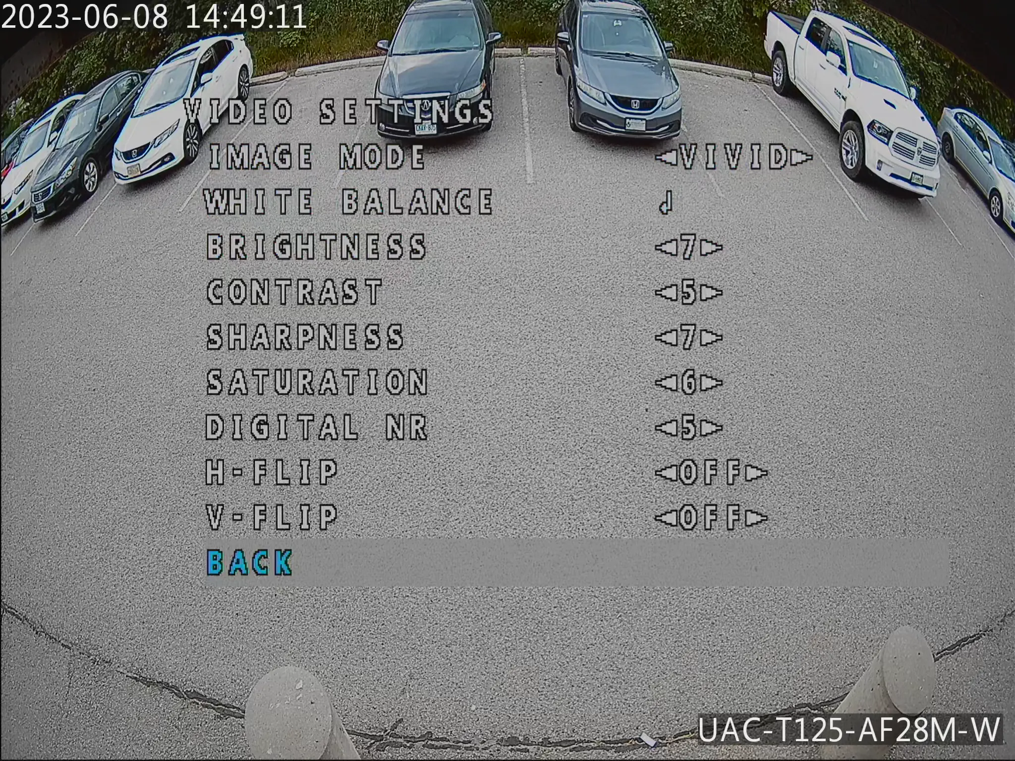 Security camera footage of a parking lot with a balanced exposure