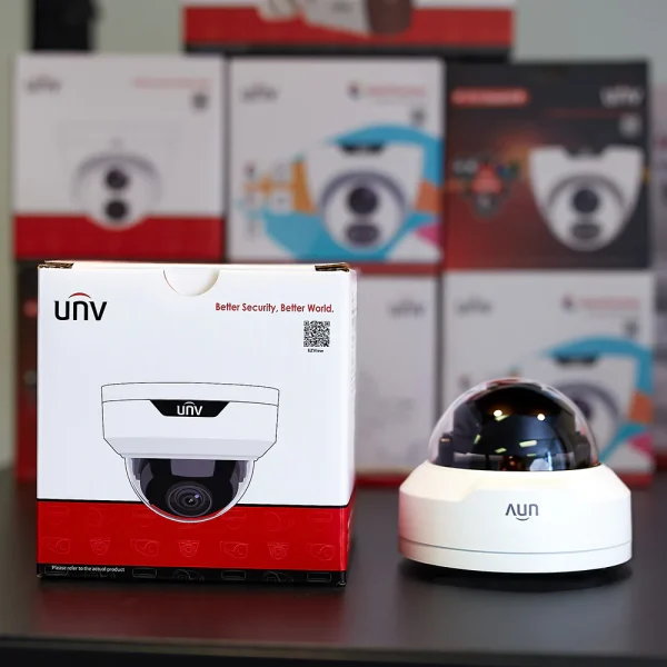 Uniview 4MP dome camera on a black shelf with retail box on the left side