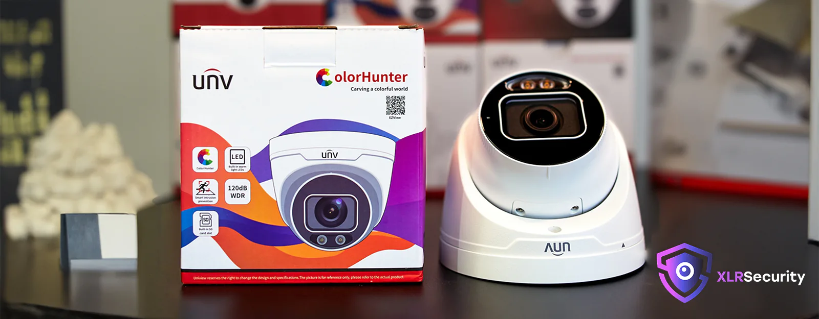 A Uniview 8MP ColorHunter camera on a black table