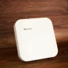 BDCOM WAP2100 wireless access point on a wooden table