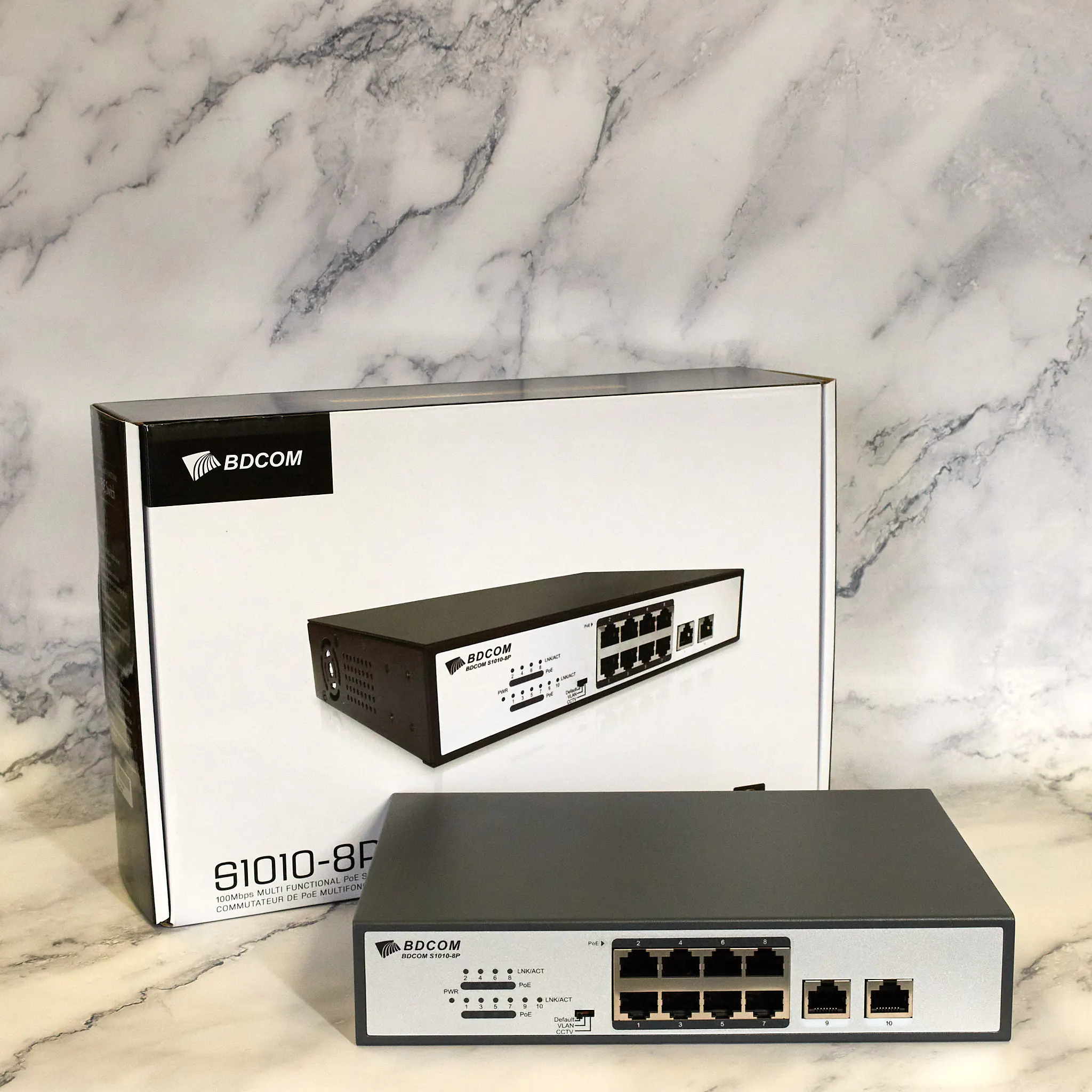 BDCOM 8-port PoE switch with the retail box in the background