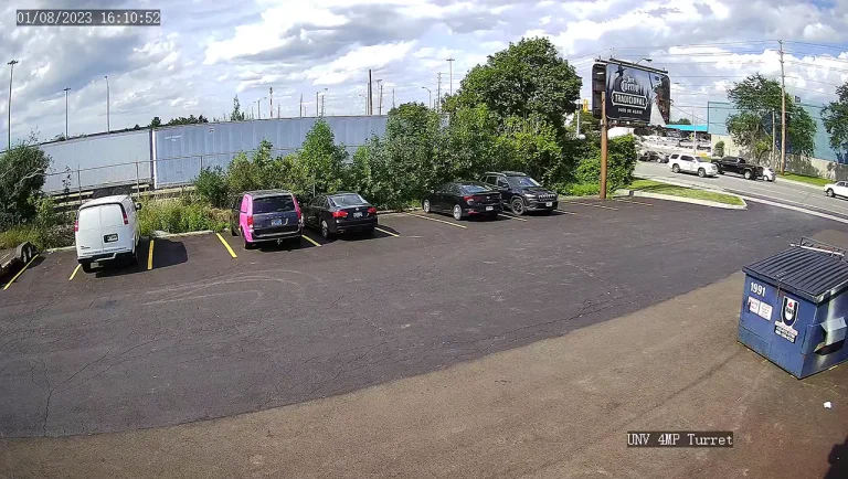 Rear parking lot of a commercial building recorded by a 4MP security camera