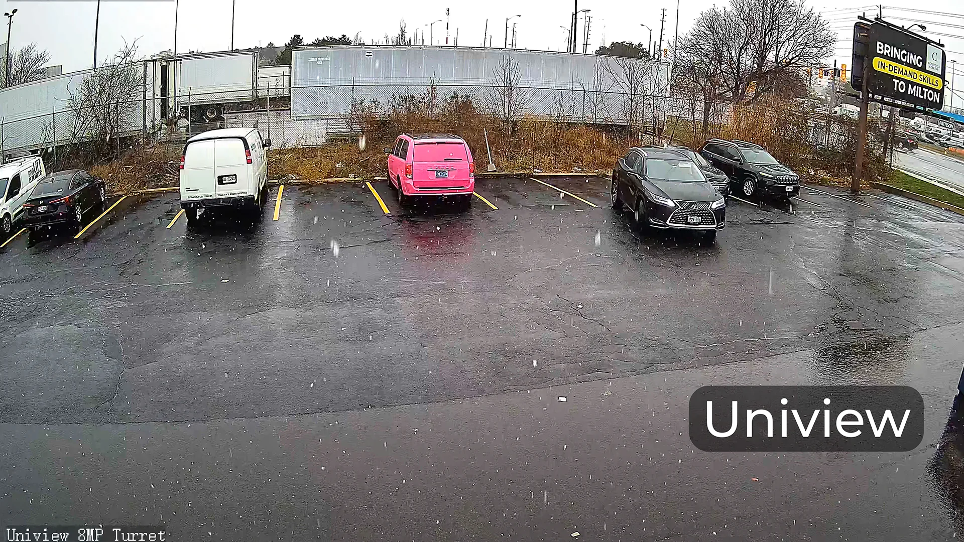 A snowy parking lot captured by a Uniview camera