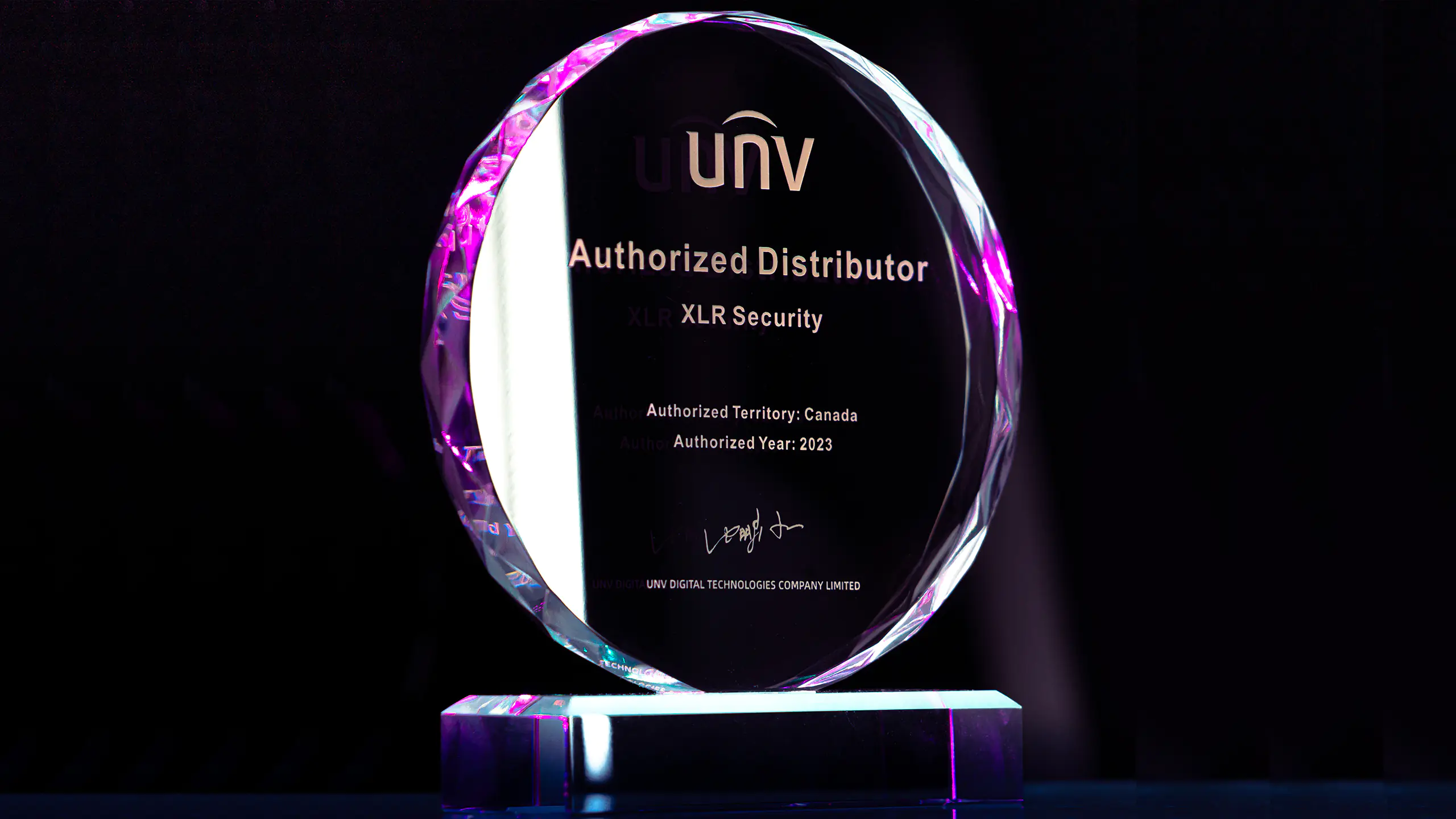 A glass plaque that says 'UNV Authorized Distributor XLR Security'.