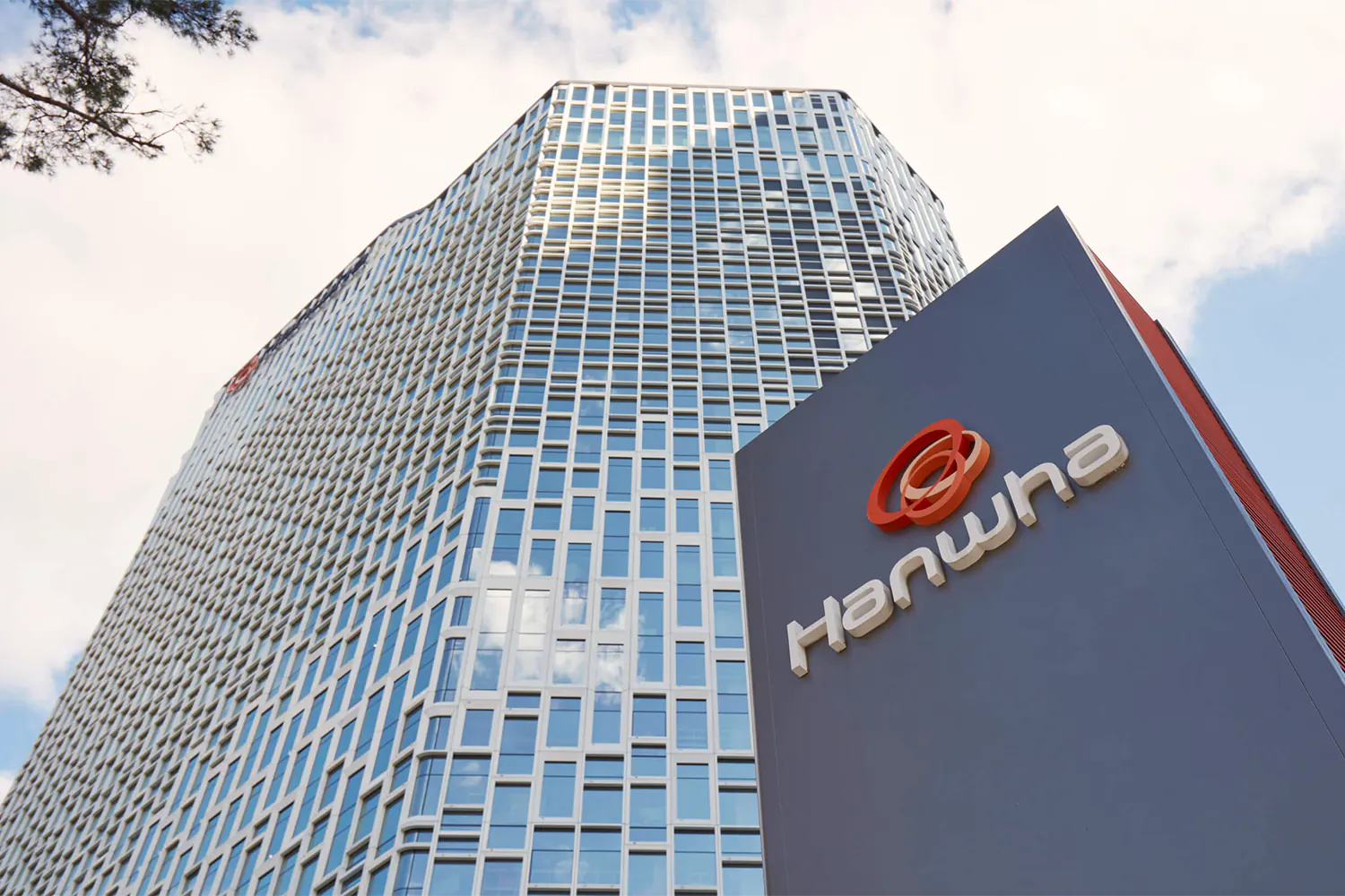 Hanwha's corporate headquarters located in Korea. A large skyscraper office building.