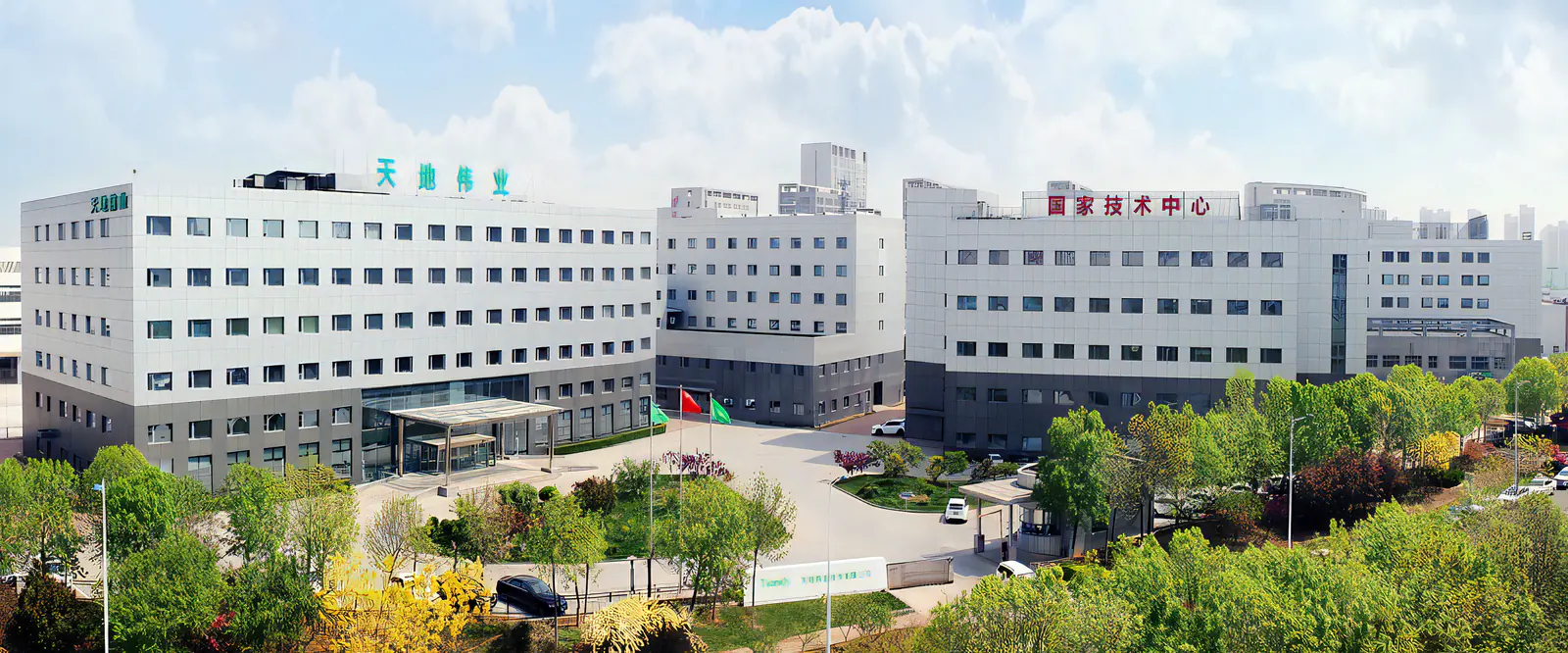 A large skyscraper office building with the Dahua Technology logo on the side. A busy city in the background.