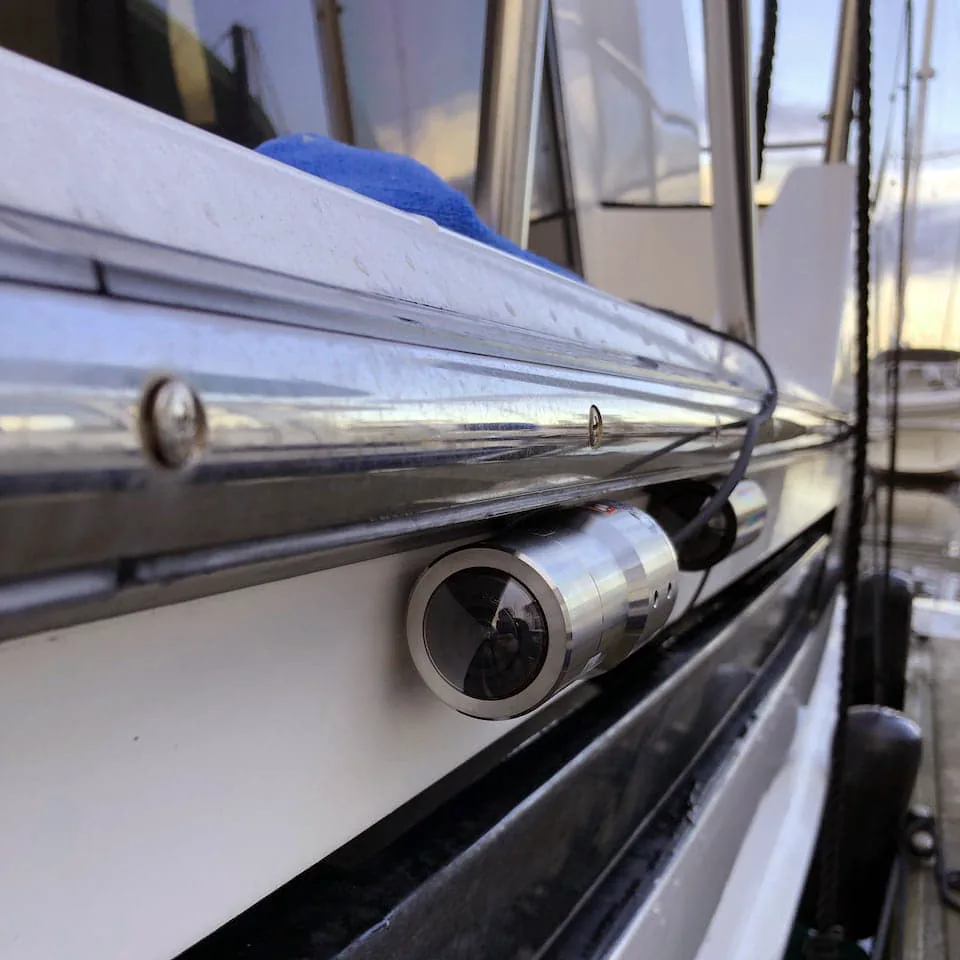 A security camera installed on the edge of a boat.