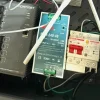 A photo of a Meanwell NDR-240-48 power supply installed inside a box powering a Fortinet Rugged Switch