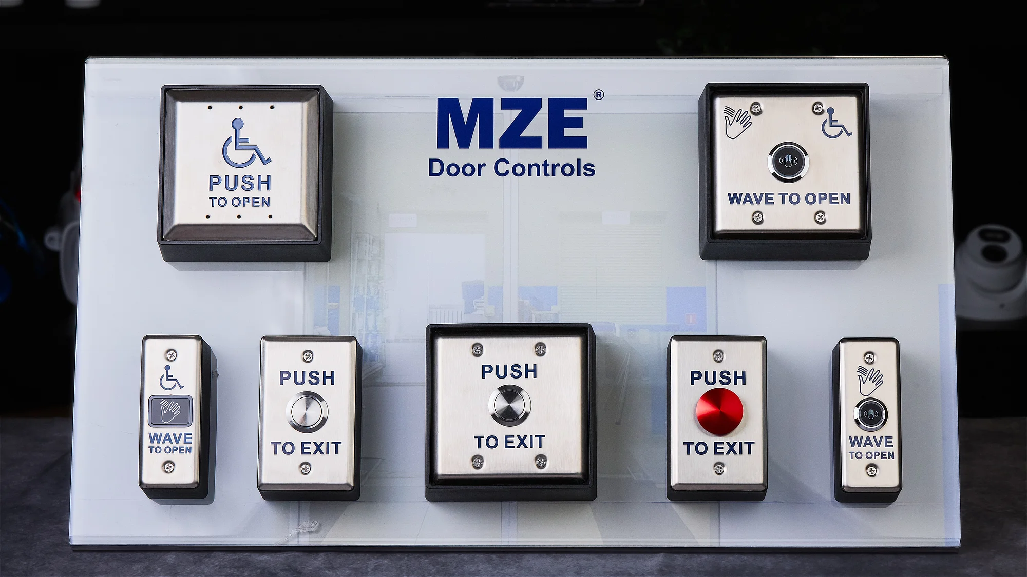 A demo board with a variety of access control buttons and switches, made by MZE Door Controls
