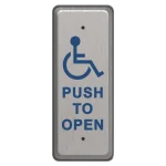 A metal push to open button with a blue handicap accessibility icon in the center, narrow version