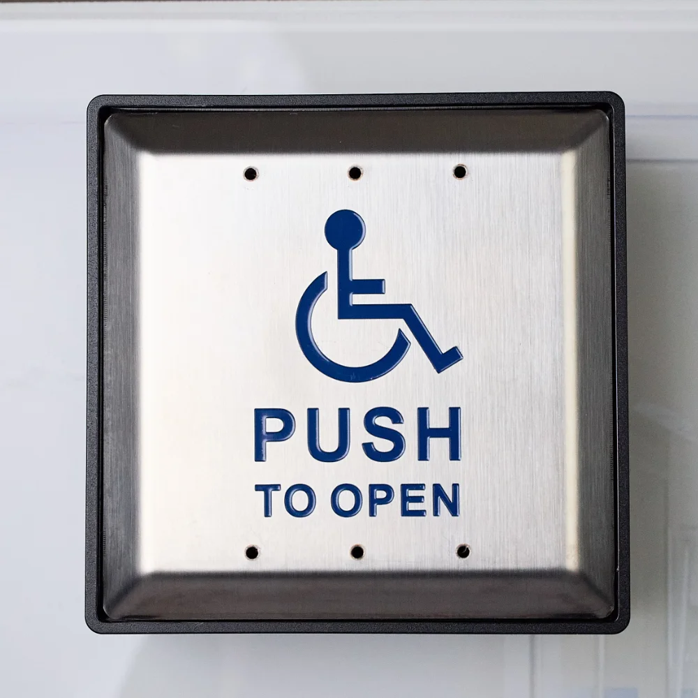 A push to open button for operating handicap, accessible doors.